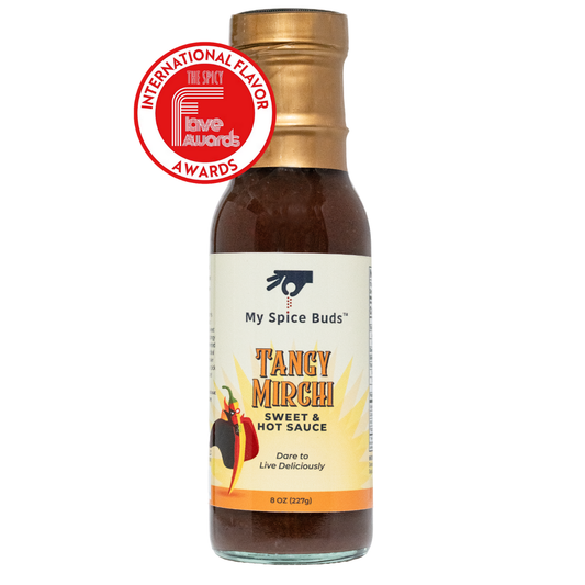 Bottle of 'Tangyrchi' sweet and hot sauce with a gold cap featuring the International Flavor Awards logo.