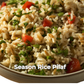 Close-up of Season Rice Pilaf with tomatoes and herbs on a white background