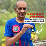 Man holding a bottle of 'Super Mirchi Hot Sauce' with text about a 50-year-old secret recipe. 14