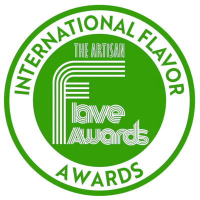 A circular green and white logo reading 'International Flavor Awards' with 'The Artisan Flavor Awards' in the center.